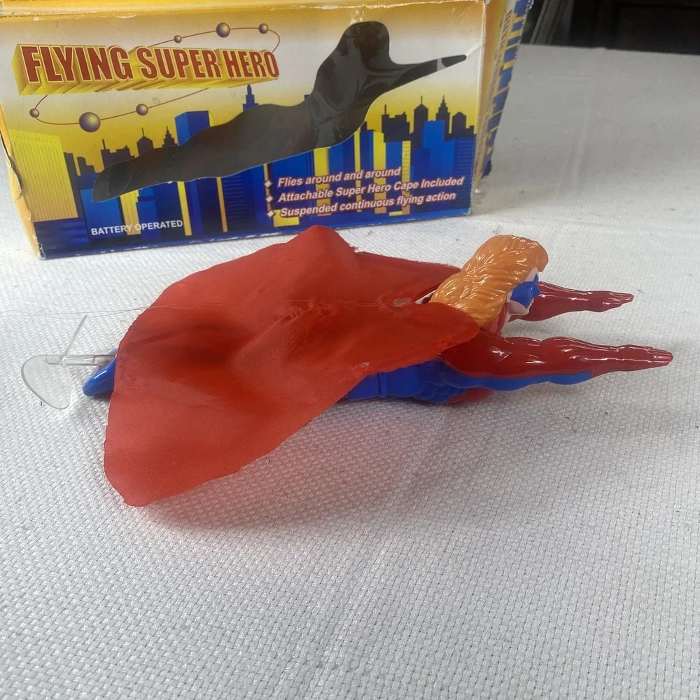Flying Super Hero Action Figure Toy Battery Operated Cape Included Spins In Air